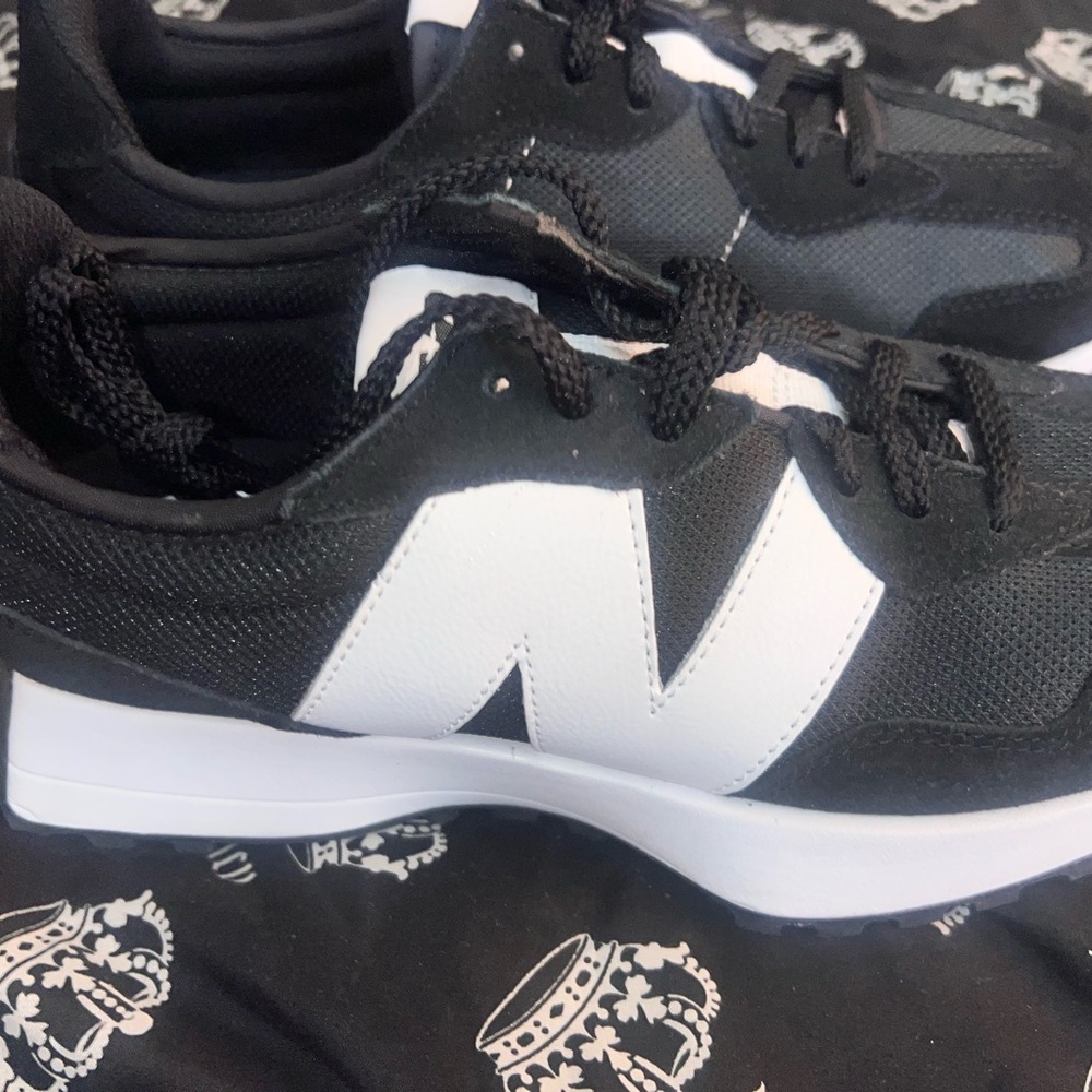 Almost brand  new New balance Black and White Women's Athletic Shoes